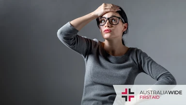 A frustrated woman holding her hand to her head